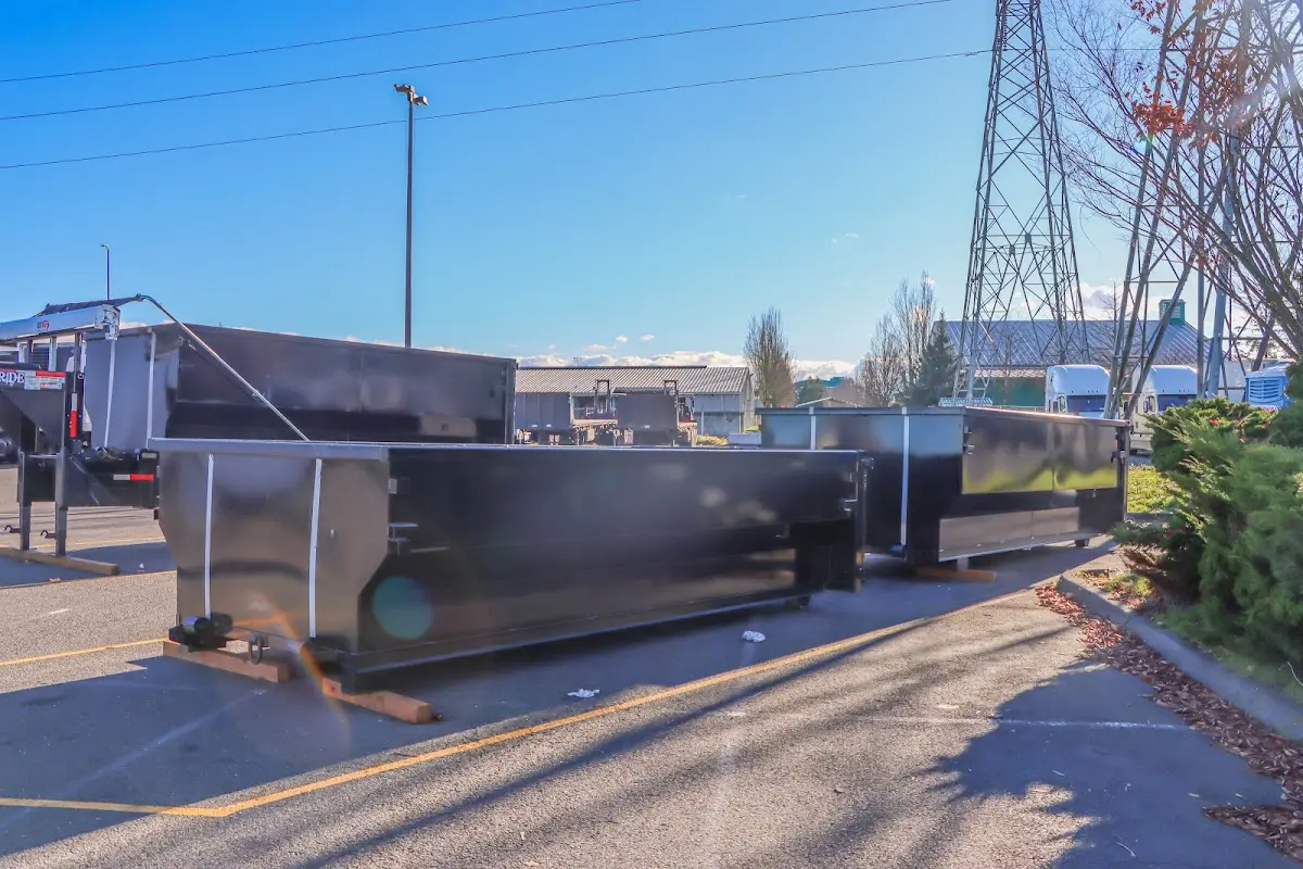 Roll-off dumpster ready for waste disposal at job site for 15 Yard Dumpster Rental in Stockbridge